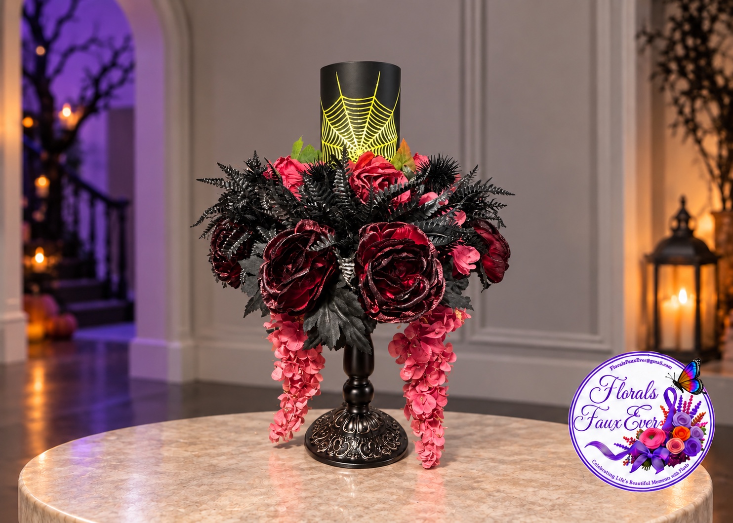 Burgundy and black Halloween floral candle arrangement with a spiderweb design